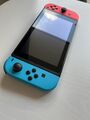 Nintendo Switch V2 32 GB Konsole mit Joy-Con Neon Rot/Blau in OVP mit Tasche