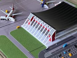 Herpa Wings 1:500 Flughafen Memmingen in Vitrine Scenix mit Zubehör/2 Modellen