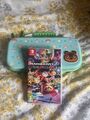 Türkis Nintendo Switch Lite, mit Mario Kart 8 Deluxe & Animal Crossing Case