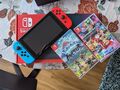 Nintendo Switch Switch neonblau/neonrot mit Pokemon Arceus und Mario Cart 8