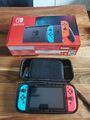 Nintendo Switch Konsole mit Joy-Con - Neon-Rot/Neon-Blau/Grau