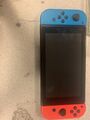 Nintendo Switch Konsole mit Joy-Con - Neon-Rot/Neon-Blau/Grau Plus 2spielen