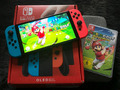 Nintendo Switch OLED + Mario Spiel (OVP wie Neu)
