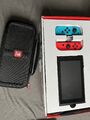 Nintendo Switch V2 Konsole + Reisetasche Joy-Con - Neon-Rot/Neon-Blau - Sehr Gut