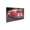 islandburner Leinwandbild Bild auf Leinwand Feuerwehrauto mit Lichtern Teil einer First Responde