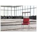 Teppich Stille und Leere - ein einsamer roter Stuhl in einer alten Halle