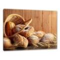 Pixxprint Leinwandbild Korb mit leckerem frischen Brot